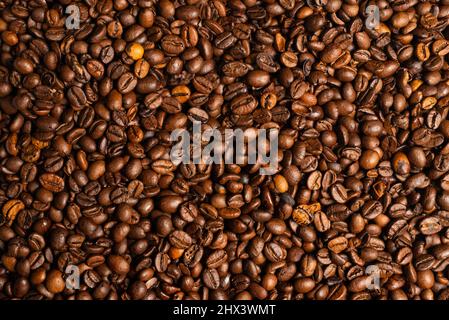 Coffee beans on a white background. Top view. Coffee beans texture. Stock Photo