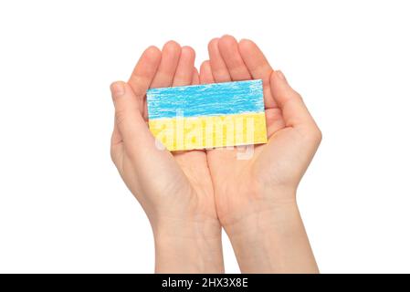 Ukrainian flag in woman hands isolated on a white background. Stop war. Stock Photo