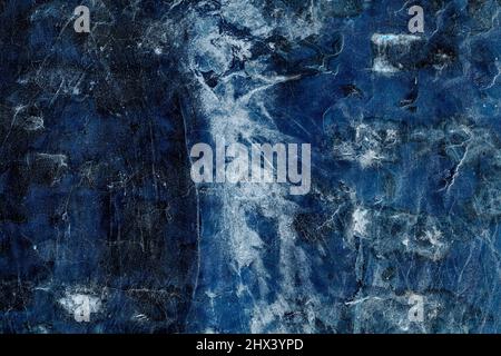 Dark blue rugged concrete wall surface with scratches and grunge texture Stock Photo