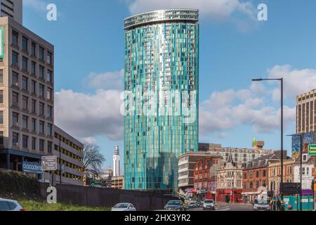 The mixed use skyscraper 10 Holloway Circus in Birmingham City centre. It's distinctive aqua colour and modern styling juxtaposed by  older buildings. Stock Photo