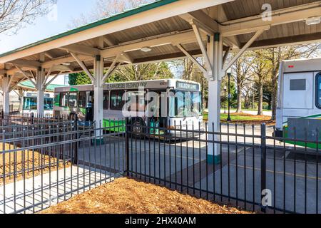 GASTONIA, NC, USA-3 MARCH 2022: City bus terminal.  Closeupshowing several buses lined up waiting for departure time. Stock Photo