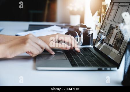 Architects or designers engineers, interior designers, female designers are using home interior design computer programs to send clients to their Stock Photo
