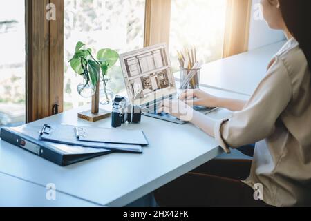 Architects or designers engineers, interior designers, female designers are using home interior design computer programs to send clients to their Stock Photo