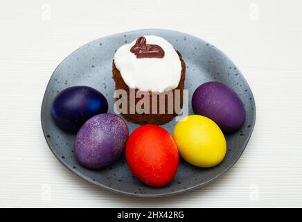 Traditional Easter cake with painted eggs prepared for the celebration of Easter. Stock Photo