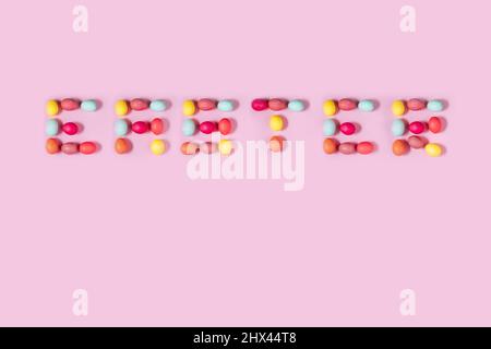 Happy Easter postcard written from  white eggs on a blue background, ideal for illustration and various use Stock Photo