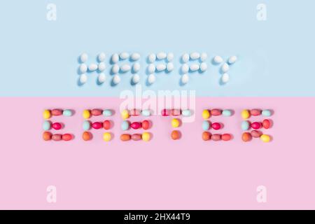 Happy Easter postcard written from  white eggs on a blue background, ideal for illustration and various use Stock Photo