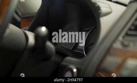 Close up for man finger pressing the car power start, stop button, transportation concept. Driver man hand pushing engine button of his car and turnin Stock Photo