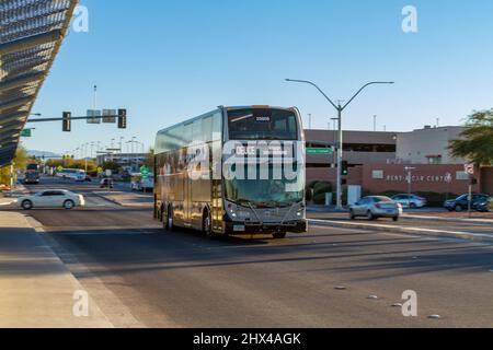 Las Vegas, NV, USA – February 17, 2022: A double decker public bus traveling on a street in Las Vegas, Nevada.
