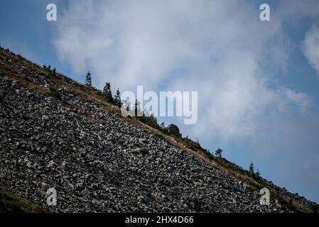 Barren, bandocks, desolations around Sudety Mountains, Poland. Scenics view of mountainside Śnieżka - Karkonosze mountain. Stock Photo