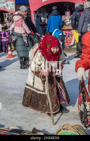 Elderly woman with a wooden stick at the Reindeer Herders Festival in Salekhard, Yamalo-Nenets Autonomus Okrug, Russia. Stock Photo
