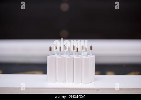 Chargers blocks for charging the phone in white. Stock Photo
