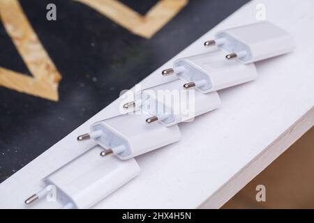 Chargers blocks for charging the phone in white. Stock Photo