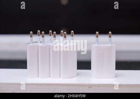 Chargers blocks for charging the phone in white. Stock Photo