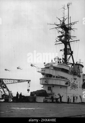 British Helicopters for Australian Navy - The three Bristol Sycamore Mark 50 helicopters which are going into service with the Royal Australian Navy, are seen in this picture coming in to land aboard the aircraft carrier 'Vengeance' off Weymouth, Dorset, January 16th. The Aircraft were ordered by the Australian navy for air-sea rescue and general communications duties after a Sycamore Mark 50 helicopter had successfully completed take-off and landing trials aboard the aircraft carrier triumph. January 16, 1953. (Photo by Associated Press Photo). Stock Photo