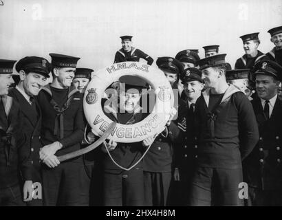 Australians Take Over British Carrier at Devenport - Cheerful Australian naval ratings with an H.M.A.S Vengeance lifebelt on board the aircraft-carrier to-day. H.M.S. vengeance, the fight fleet carrier which is being lent to the Royal Australian Navy, was turned over to an Australian naval steaming party at Devonport today (Thursday). The party, consisting of 550 officers and men, arrived at Plymouth recently from Australia. They will take the carrier to Australia early in the coming year. November 13, 1952. (Photo by Reuterphoto). Stock Photo