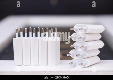 Chargers blocks for charging the phone in white. Stock Photo