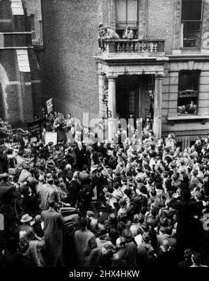 Churchill Leaves Polling Station - Cheered by Huge Crowds. Huge Crowds Churchill, cheering him as he leaves the polling station after casting his vote in the General Election today (Thursday). He an be seen between the two doorways. Mr. Churchill voted in St. Stephen's Church Hall, Emperor's Gate, Gloucester Road, London. October 25, 1951. (Photo by Reuterphoto). Stock Photo