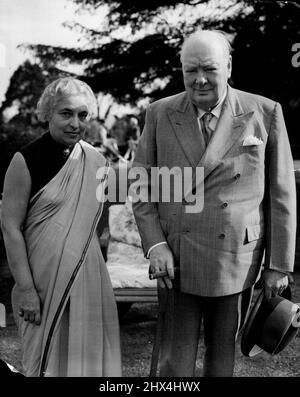 Mrs. Pandit at Chartwell: Tea with Sir Winston - Mrs. Pandit with Sir Winston Churchill at Chartwell to-day. Mrs. Vijaya Lakshmi Pandit, sister of Indian Premier Jawaharlal Nehru and President of the United Nations General Assembly, had tea with Sir Winston and Lady Churchill at their Chartwell (Kent) home to-day, Sunday. Mrs. Pandit arrived in London last Monday for a week's official Assembly. Her engagements have included an audience with the Queen. July 11, 1954. (Photo by Reuterphoto). Stock Photo