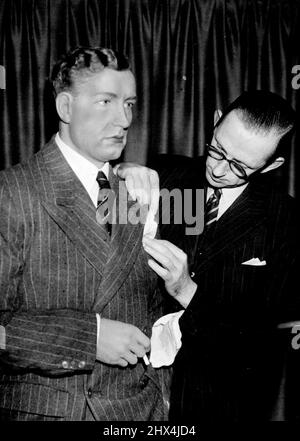 Heath Model in Madame Tussaud's -- Putting the finishing touches to the Heath model at Tussaud's today. Heath is not wearing his favourite RAF tie. An effigy of Neville Heath, the murderer, has been put on show in Madame Tussaud's among the wax models of famous figures. October 18, 1946. (Photo by Fox). Stock Photo