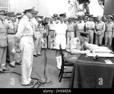 Isett Signs For New Zealand -- Air Vice Marshall Isett of New Zealand signs Jap Surrender document for his Government in ceremony Sept. 2 (Tokyo time) aboard the USS Missouri, Tokyo Bay. May 9, 1945. (Photo by Frank Filan, Associated Press Photo). Stock Photo