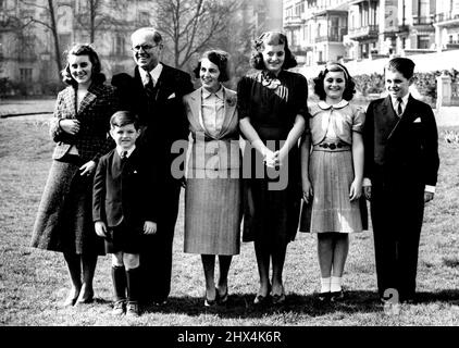 U.S. Ambassador And Family In London. The Kennedy family facing the camera (L to R) Kathleen; Mr. Kennedy; Mrs. Kennedy; Patricia; Jeanne; Robert and (in front) Edward. Last night Mr. Joseph Kennedy, the new American Ambassador to London went down, to Plymouth to meet his wife and five of his nine children off that Washington, from America. The remainder of the family are still in America Today the Ambassador and his wife were settling down at the American Embassy in London. March 16, 1938. (Photo by Keystone). Stock Photo