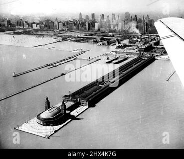 Navy Pier For University This is an airview of the navy pier on Lake Michigan water front where the city agreed to lease space to the University of Illinois to house a branch. According to the trustees of the University, from 3,500 to 4,000 students could be accommodated at this annex when it is expected to be in operation for the fall term. June 16, 1946. (Photo by Wide World Photos). Stock Photo