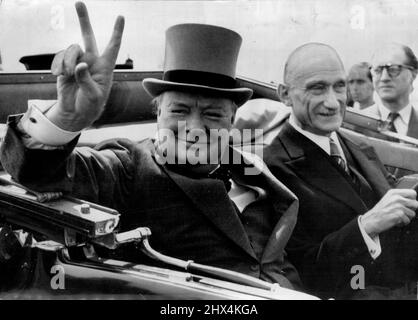 Churchill In V-Humour In Metz -- Mr. Winstons Churchill Ex-Premier, gives his 'V' sign as he drives through world famous 'V' sign as he drives through cheering inhabitants of the French Town of Metz on the way to a civil banquet. With him is M. Robert Schuman, French Minister of Finance. July 16, 1946. (Photo by Associated Press Photo).
