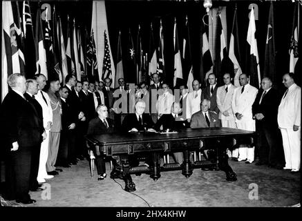 The Fight For Freedom Gets Two New Allies -- Representatives of the two latest countries -- Mexico and the Philippines--who joined up to fight the good fight under the banners of the United Nations are seated on either side of President Roosevelt in the White House at Washington, behind a desk used by Abraham Lincoln, great U.S. Civil War President as allied leaders met to reaffirm the United Nations' pact on America's Flag Day. Left to right, at the desk, are; Mexican Ambassador Dr. Francisco Castillo Najera; President Roosevelt; Manuel Quezon, President of the Philippine Commonwealth, and U. Stock Photo