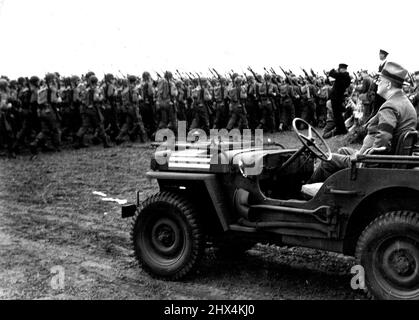 American Infantrymen And President Roosevelt At Casablanca -- From the front seat of a jeep, President Franklin D. Roosevelt reviews infantry units of the U.S. Army in French Morocco during his stay at Casablanca. September 28, 1943. (Photo by Interphoto News Pictures, Inc.). Stock Photo