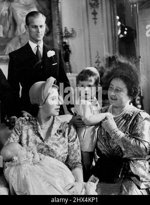 The Christening of Princess Anne - Princess Anne, the second child of H.R.H. Princess Elizabeth and the Duke of Edinburgh, was christened at Buckingham Palace on October 21st, 1950. H.M. The Queen, holding Prince Charles, talks to H.R.H. Princess Elizabeth Who has Princess Anne in her arms. Standing behind is H.R.H. the Duke of Edinburgh. November 08, 1950. (Photo by Baron, Camera Press). Stock Photo