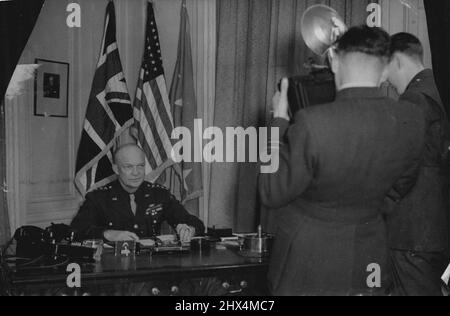 General Eisenhower In London -- General Eisenhower faces a barrage of cameras in his London office. He has assumed the Supreme Command of the Allied Expeditionary Forces. General Dwight D. Eisenhower, 53-year-old Supreme Commander of the British and American Expeditionary Forces organizing in the United Kingdom, has arrived in London. January 17, 1944. (Photo by Plant News Ltd.). Stock Photo