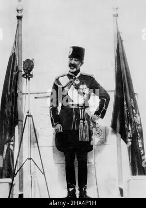 Afghanistan Celebrates Independence Day -- A close - up of his Majesty King Nadir Khan, of Afghanistan, making his royal speech on the occasion of the celebration of Independence Day recently. On both his sides are the National flags of Afghanistan. -- Afghanistan is the wilde stretch of country on the north of India. September 19, 1933. (Photo by Keystone). Stock Photo