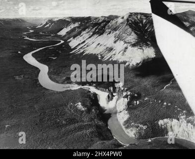 This aerial view of Virginia Falls ***** South Nahanni River, reveals some of the magnificent scenery along Route D. The falls are near Simpson, at which point, the Highway would continue along the MacKenzie River and then along the old 'Trial of '98' to Dawson, in the Yukon. January 8, 1941. (Photo by ACME). Stock Photo