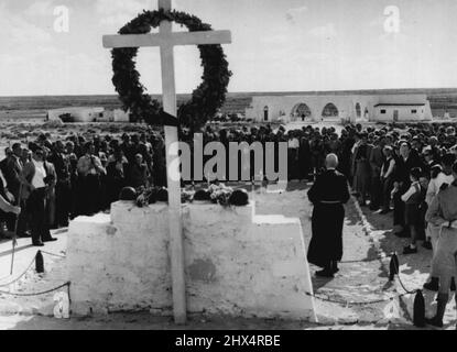 German-Italian Remembrance Day In Alamein -- A German priest officiating at the German-Italian cemetery at Tel-el-Eyssa, in Alamein, on the German Remembrance Day. Members of the German colony in Egypt stand around him as they take part in the service. November 19, 1952. Stock Photo