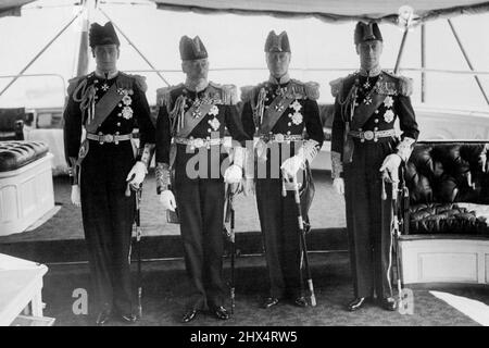 His Majesty King George Reviews Fleet at Spithead -- Our photograph shows His Majesty the King with his three sons. From left to right: The Duke of Kent; The King; The Prince of Wales and the Duke of York. August 12, 1935.