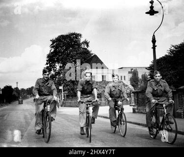 Italians Help In Britain.A party of 'Co-operatives' after finishing a day's work are seen enjoying the beauty of the English countryside on cycles.More than 60,000 Italian Prisoners of War in this country have taken advantage of the ***** Government's invitation to become ***** in the common war effort.***** 'Co-operatives', as they are now played, are formed into units organised ***** by Italian officers and N.C.O.'s and are not permitted to talk with members of the public, visit private buses, if invited to do so, and visit ***** at the discretion of their O.C., but they not enter public hou Stock Photo