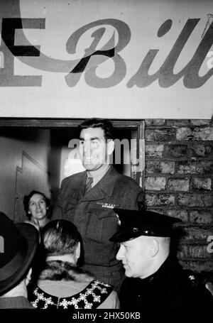 Korean Hero Comes Home -- Pte William Speakman, V.C. photographed with his mother at the door of his home in Moss Lane, Altrincham on his arrival on leave on Wednesday 30th Jan. A magnificent welcome was accorded to Pte William Speakman, 6 ft. 4 ins hero of the Korean Campagn, who was awarded the V.C. for gallantry there, when he arrived back in his home town of Altrincham. January 31, 1952. (Photo by Fox Photos). Stock Photo