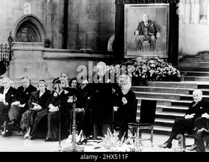 Prime Minister Celebrates His 80th Birthday -- Sir Winston Churchill speaking after the presentations in Westminster Hall.L to R: Sir Anthony Eden, Foreign Minister: Mr. McLeavy, M.P.: Mrs. Attlee, wife of Mr. C.R. Attlee, Leader of the Opposition: Behind Sir Winston are Lady Churchill and Mr. W.S. Morrison, Speaker of the House of Commons.At a ceremony held in the ancient Westminster Hall the Prime Minister Sir Winston Churchill was presented with an oil painting of himself and also a bound volume holding the signatures and good wishes of almost all the Members of both Houses of Parliament a Stock Photo