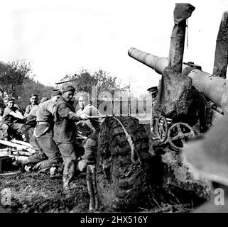 Fifth Army Fights Mud And Germans On Roccamonfina A 5. 5 medium field gun, of a British regiment being towel, manhandled and bought into action position, over very bad country on top of Mount Roccamonfina. The men had great difficulty getting these guns into position owing to the soft nature of the earth, as can be seen by the deep wheel tracks. February 22, 1944. (Photo by British Official Photograph). Stock Photo