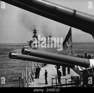 King's Visit To The Fleet -- The King led the Fleet to sea in H.M.S. Nelson, flagship of the Home Fleet. The Second Battle Squadron seen under the 15' guns of H.M.S. Royal Oak with Revenge, Royal Sovereign and Ramillies astern during the first day of the Naval Review. September 04, 1939. (Photo by Paul Popper). Stock Photo