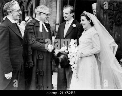 Family AffairDoctor W.E. Sangster shakes hands with his bridegroom son after the ceremony, performed by the bride's father, the Rev. Charles Tudor (left).The father of the bride officiated at the wedding at Musewell Hill Mathodist Church to-day of Mr. Paul Sangster, a lay preacher in the Methodist Church, and 26-year-old Miss Mary Tudor, daughter of the Rev. Charles Tudor, secretary of the Methodist home mission department. He was helped by the father of the Westminster Central Hall and former president of the Methodist conference.The bridegroom is a school-teacher and 25 years of age. August Stock Photo