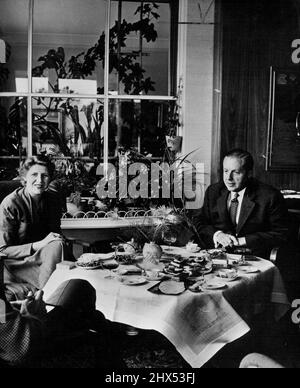 Rulers of the Ruhr: Dr. Gerhard Schroeder -- Director of the Klockner-Berg-und Huttenwerke AG, Duisburg. This mining and metallurgical organization owns another six gigantic Ruhr concerns. Dr. Schroder is here shown at breakfast with his wife. August 11, 1954. (Photo by Camera Press). Stock Photo