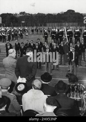 Members of the Australian Olympic team were farewelled on June 7 1952 at an athletic carnival at Moore Park, Sydney. The Governor-General Sir Wm McKell State Govt officials military authorities and sporting reps were present. They are shown here in front of a guard of honour at Moore Park as the Gov Gen makes a farewell speech. June 10, 1952. Stock Photo