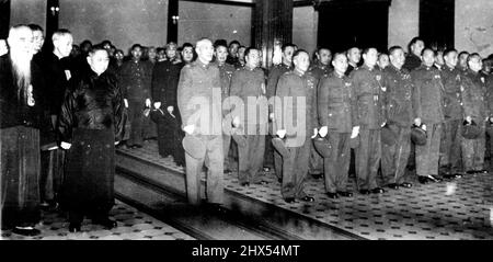 Ching Prepares To Deliver Message To Chinese - Chinese government officials stand at attention Jan. 1 as President Chiang Kai-shek enters the Nanking government office building to deliver his New Year's message. Nearest Chiang at left is Premier Sun Fo. Nearest Chiang at right is Gen. Li Tsung-jen, vice-president. At extreme left is bearded Yu Yu-jen, president of the Control yuan. Chiang, expressing readiness to step down, said 'if peace can be secured I am not concerned with my position.' January 5, 1949. (Photo by AP Wirephoto). Stock Photo