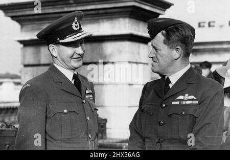 Commemorating The 'Battle Of Britain' -- ***** J.L. Hurley (left) Royal Canadian Air Force, ***** Air Commodore E.G. Knox-Knight, royal ***** Australian air force, while waiting for the 200 R.A.F and U.S.A.F planes to pass over London during the great 'fly past' commemorating the 8th anniversary of the 'Battle of Britain'. September 15, 1948. (Photo by Sport & General Press Agency Limited.). Stock Photo