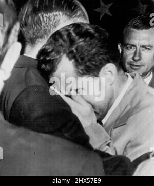 Nixon Breaks Down -- Sen. Richard M. Nixon puts his hands to his face as he breaks down on the shoulder of Sen. William Knowland of California, after completing his speech before Eisenhower rally here tonight. Nixon flew here to meet Gen Dwight Eisenhower. After an emotional television defense of his former financial affiliations, Nixon breaks down, cries. September 24, 1952. (Photo by AP Wirephoto). Stock Photo