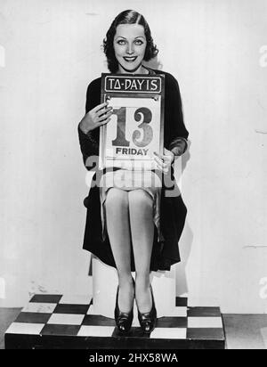 Adrienne Ames, Paramount's screen siren, makes some preparations to slay the Friday, the 13th bugaboo. March 17, 1950. (Photo by Paramount Pictures). Stock Photo