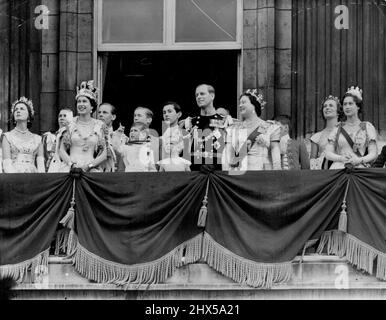 Queen Takes R.A.F. Salute - With a Pointer From Princes Charles -- Beside the smiling Queen wearing the Imperial State Crown Prince Charles points skyward from the balcony of Buckingham Palace 168 jet fighters fly over in the *****air force salute to her *****. January 01, 1953. Stock Photo