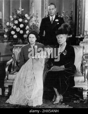 Four Generations of Britain's Royal Family - The royal line of Windsor is represented by four generations in this picture made at Buckingham Palace, Wednesday, after the christening of Princess Elizabeth's son. Sitting next to Princess Elizabeth, Who holds Prince Charles Philip Arthur George, is her grandmother, Dowager Queen Mary. Standing behind the group is King George VI. December 17, 1948. (Photo by AP Wirephoto). Stock Photo