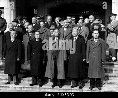 Jap War Crimes Defendants in Group : This is the first group picture of high ranking military and other Japanese officials as they posed for a new year's photograph on the steps of the International Military tribunal for the far east, Tokyo where they are being tried on war crimes charges. Hideki Tojo, Former Premier and No. 1 Japanese on trial is fifth left, top row (bald, wearing glasses). January 6, 1948. (Photo by Associated Press Photo).